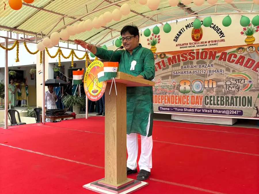 Addressing the school from the podium