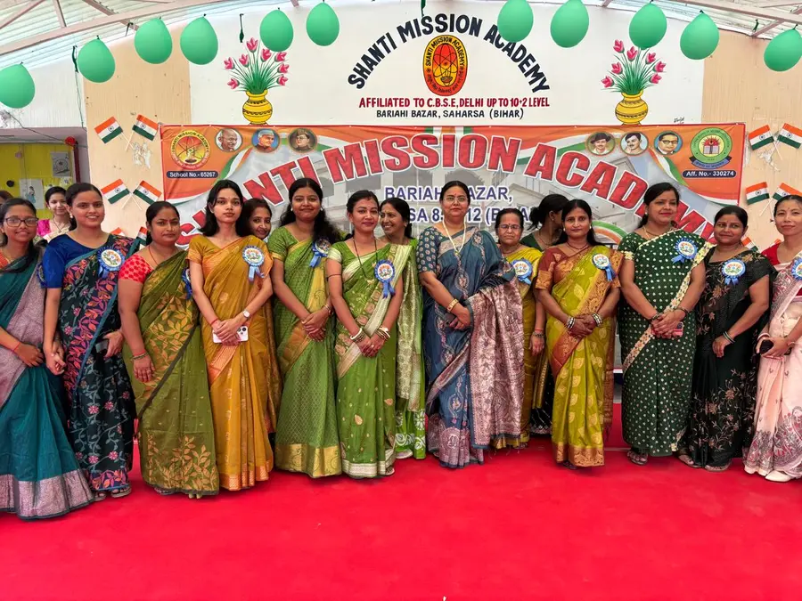 Teachers at the Independence Day banner
