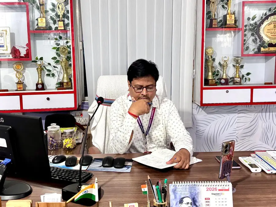 At the desk in the school office