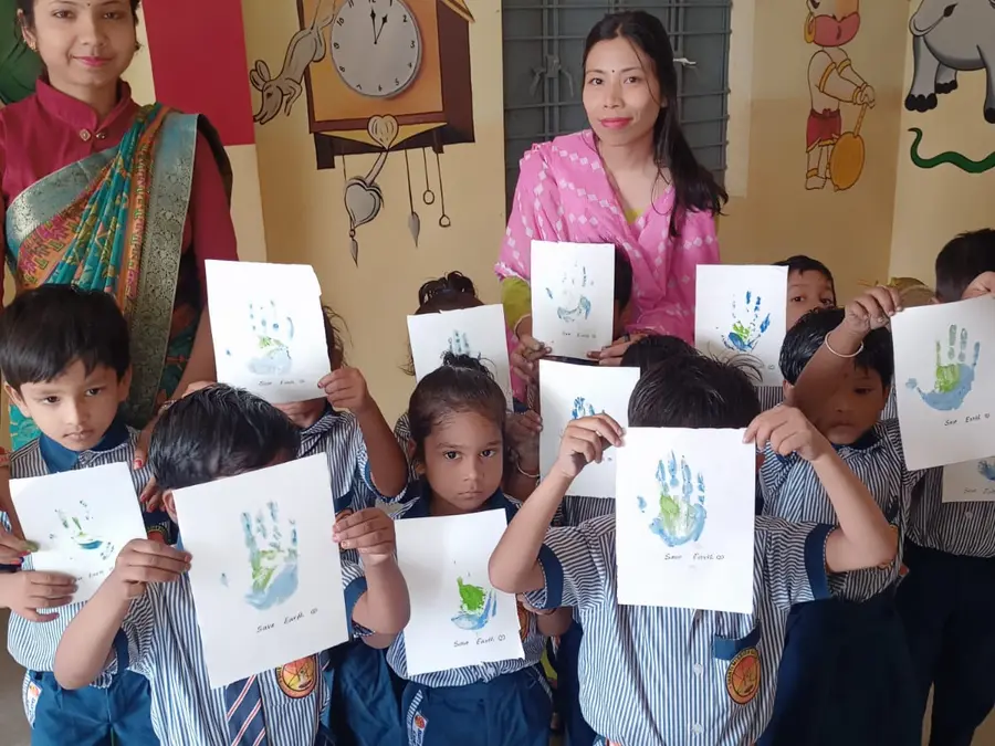 Pre-primary children with their drawings